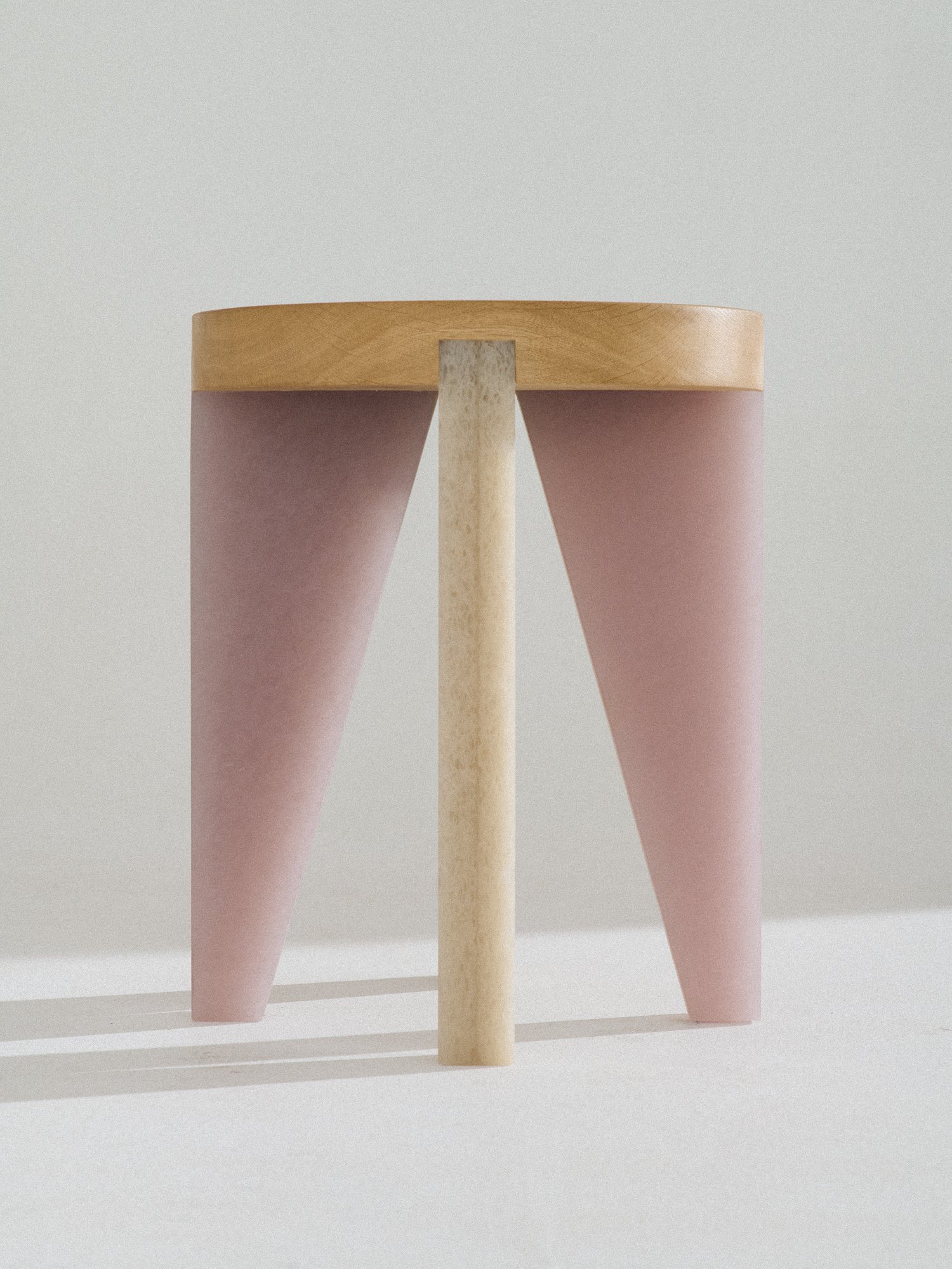 NANO Stool with an oak seat on pink and natural Karlite legs