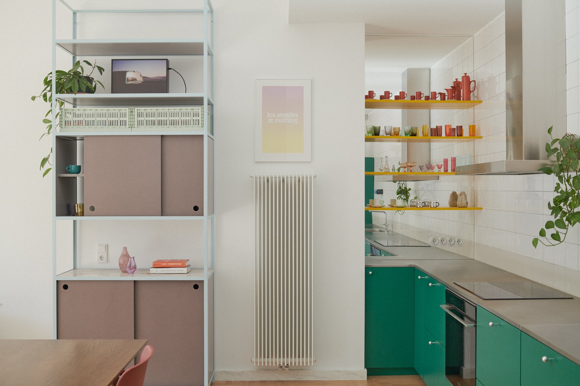 E6 apartment: kitchen with an open shelving unit and green cabinets